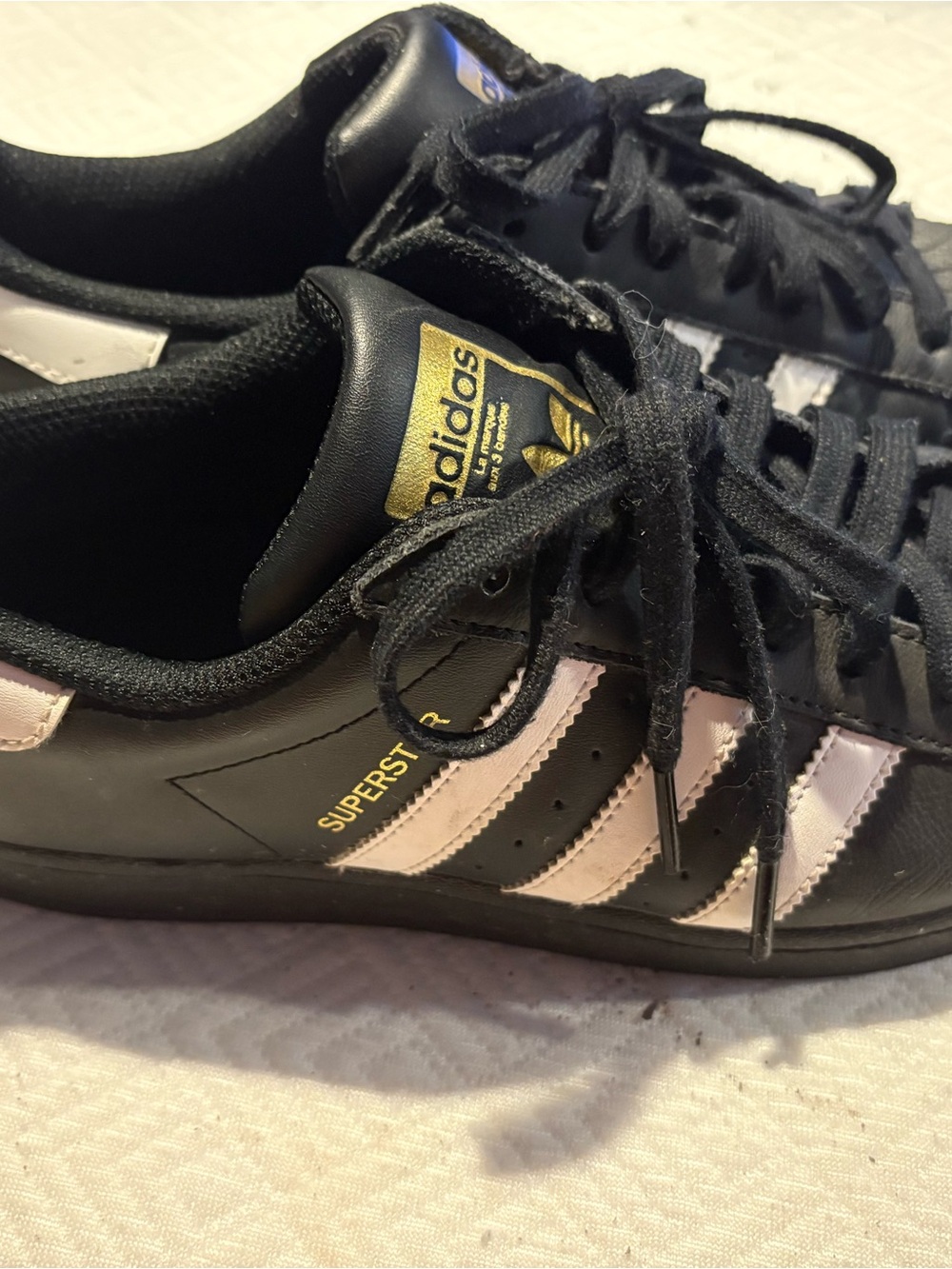 adidas Black and Light Pink Superstar Sneakers
